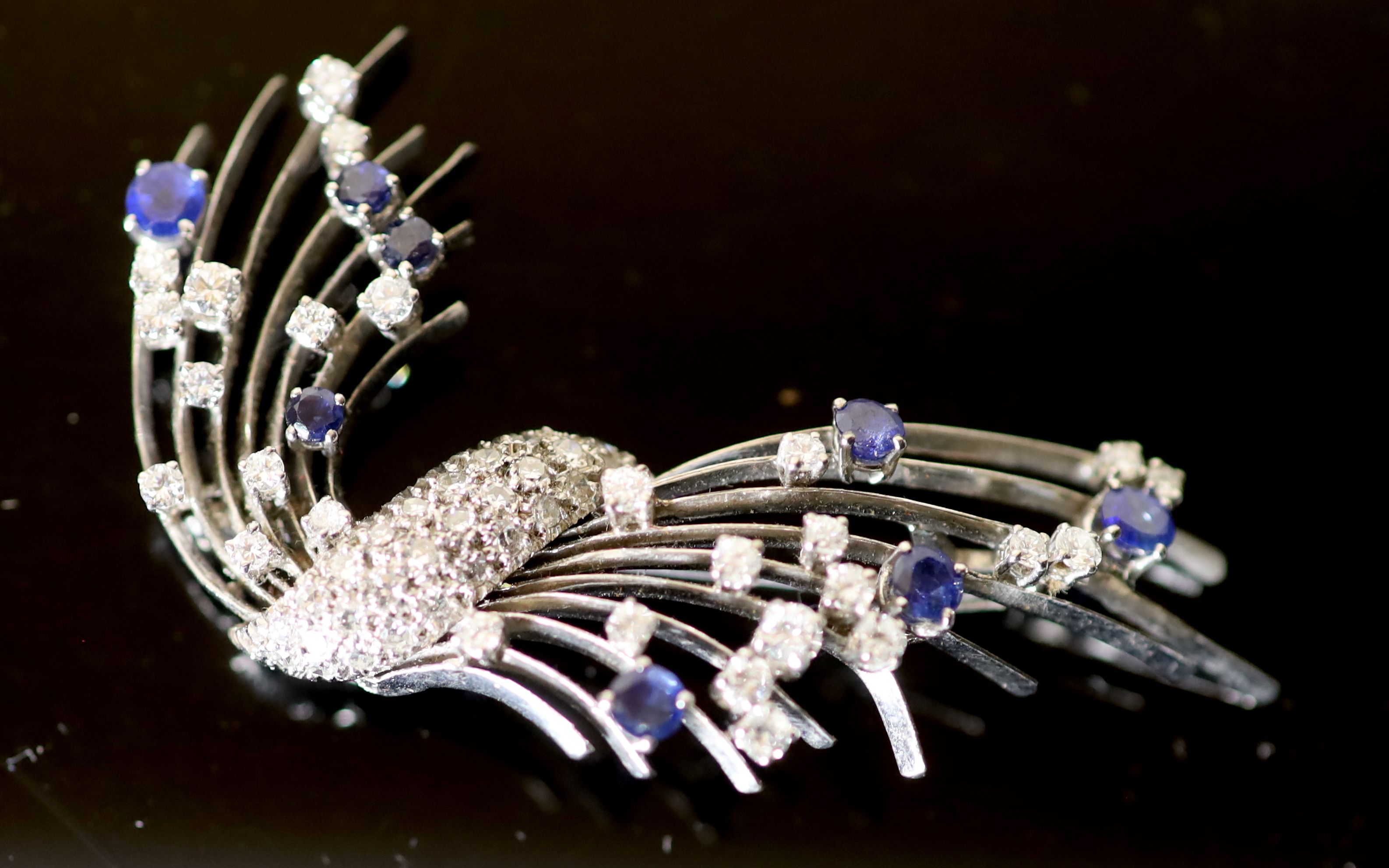 A platinum?, diamond and sapphire set spray brooch,